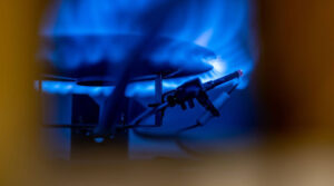 Close-up of water heater pilot light.
